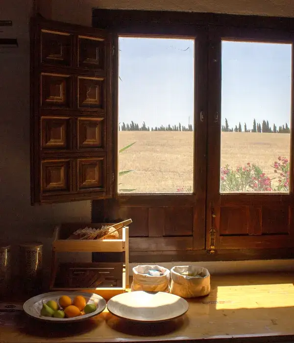 Morning light through the shuttered doors of the house