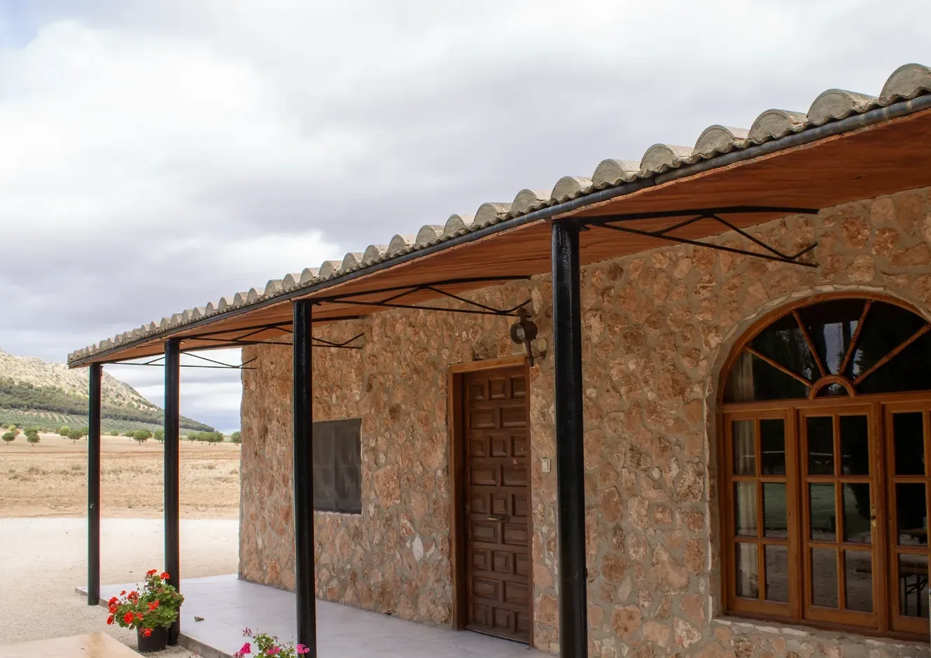 The shaded veranda at the front of the farmhouse at Sierra Recovery