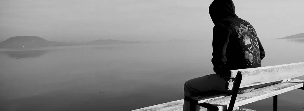 man sitting on bench
