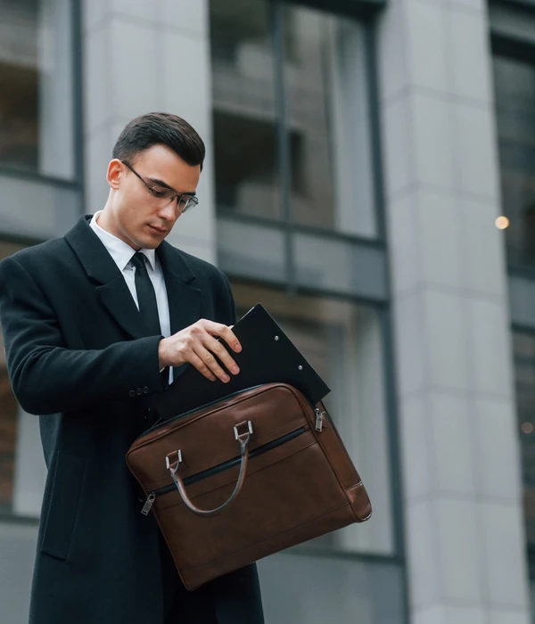sierra recovery executive man suit tie holding briefcase