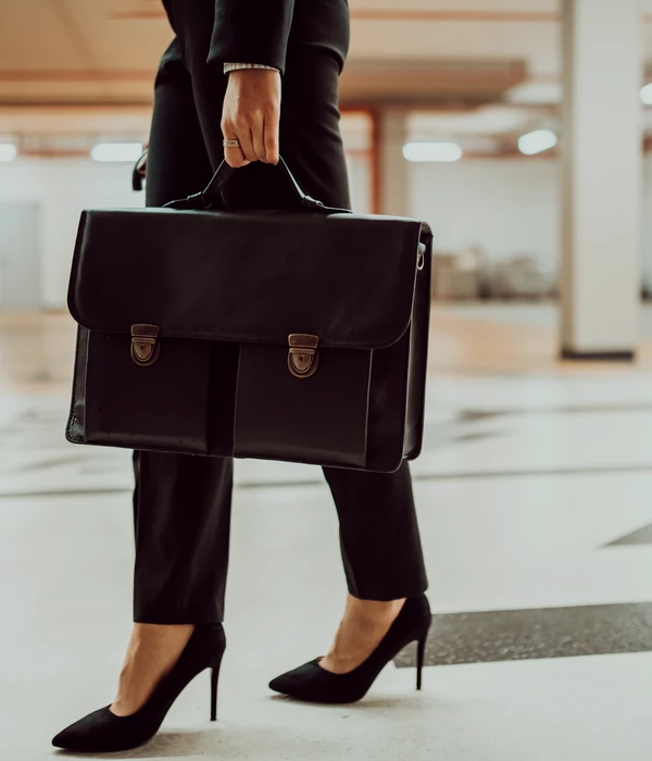 sierra recovery executive woman suit holding briefcase