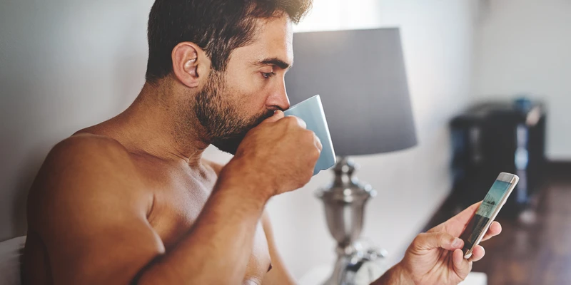 sierra recovery man looking phone while holding sex porn addiction