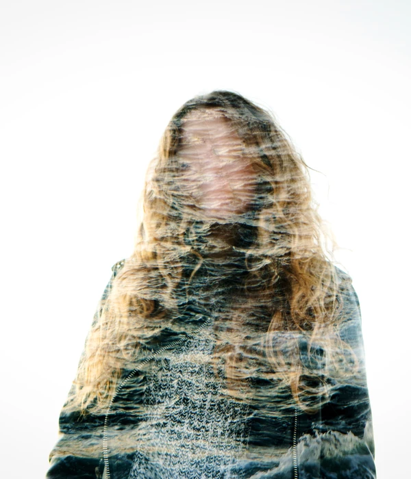 sierra recovery mental health woman long hair standing front white