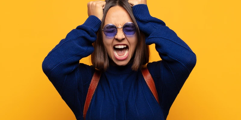 sierra recovery mental health woman sunglasses covering eyes screaming
