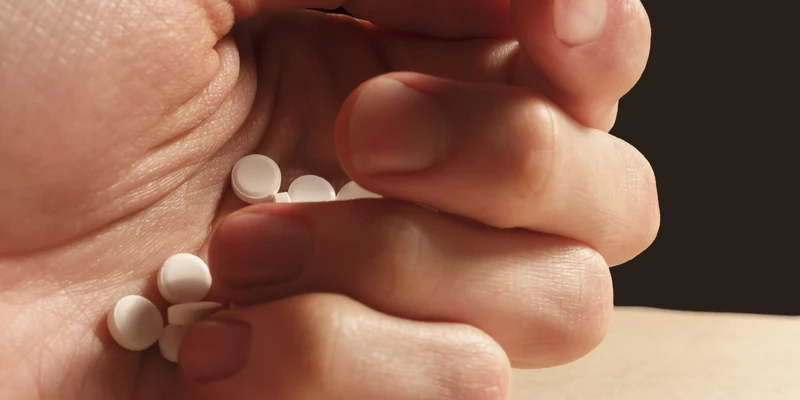 sierra recovery opioid person holding pill hand