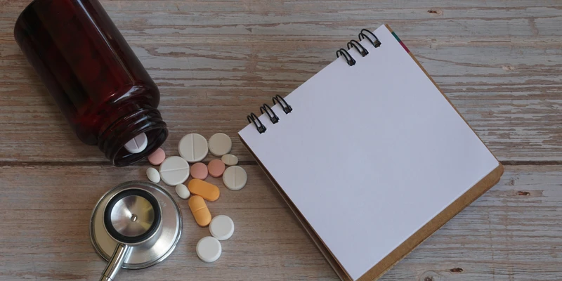 sierra recovery prescription drug bottle pills ste notepad wooden table