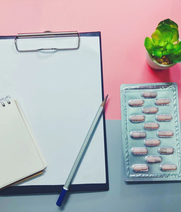 sierra recovery prescription drug clipboard pills pen pink background