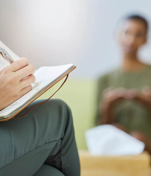 sierra recovery therapy person sitting couch book lap