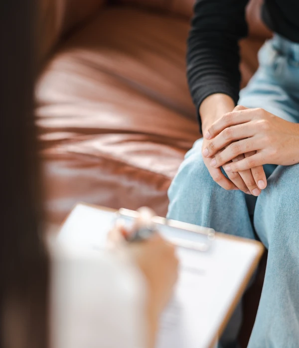 sierra recovery therapy woman sitting couch holding hand