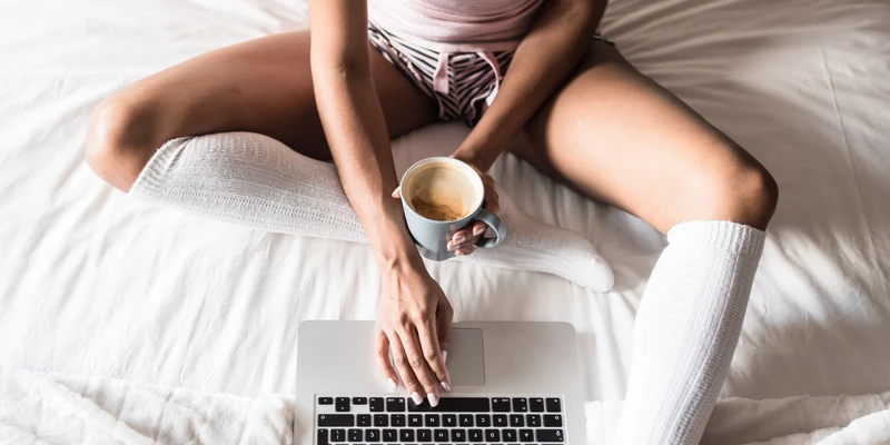 sierra recovery woman sitting bed laptop sex porn addiction